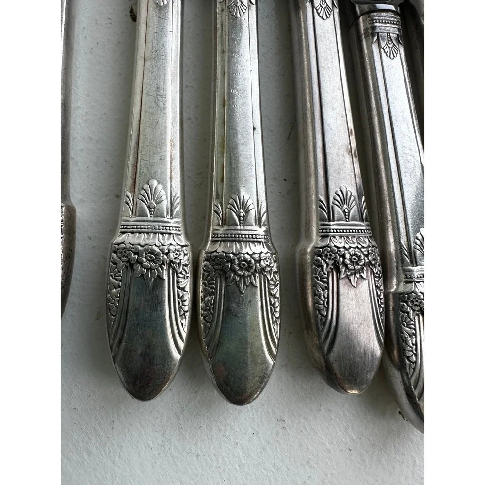 1937 Roger's Co. set of 8 First Love pattern stainless butter knives